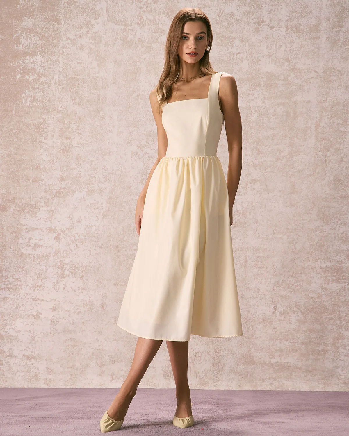 The Light Yellow Pleated Cross Back Midi Dress