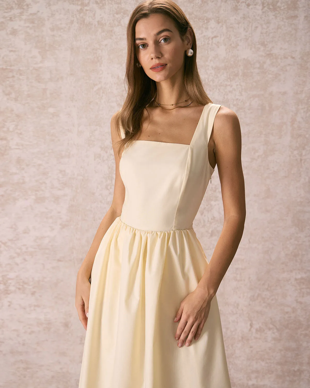 The Light Yellow Pleated Cross Back Midi Dress